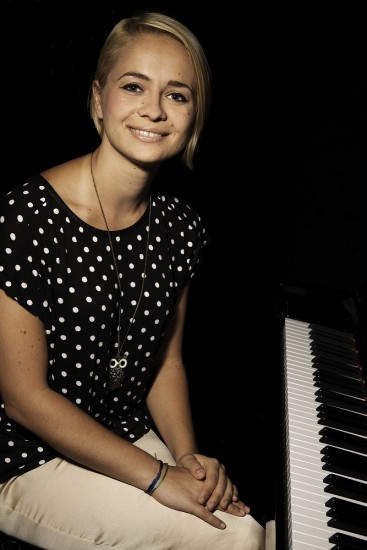 Magdalena sitting at the piano