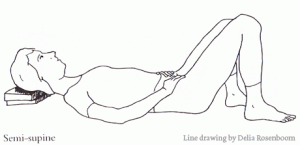Picture of a lady lying down in a semi supine position